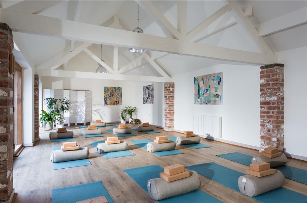 The studio space transforms into a wellness space complete with yoga mats