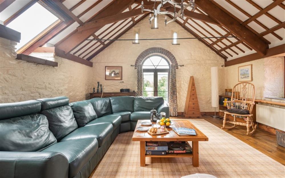 Relax in the living area at The Barn at Widland Farm in Modbury