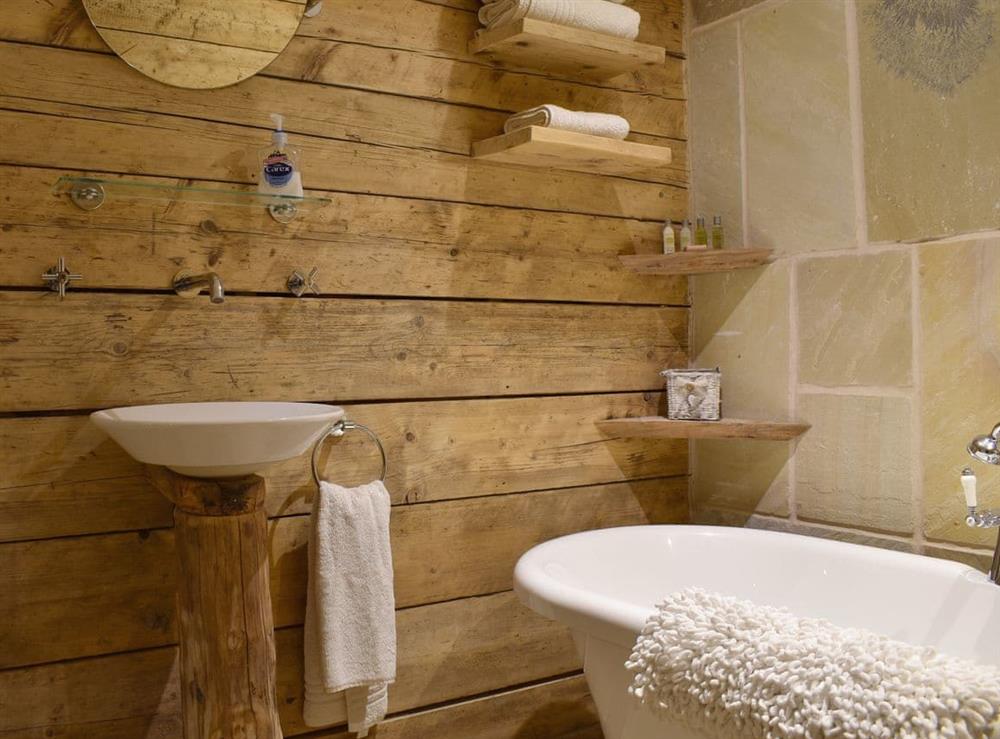 Bathroom with free-standing bath at The Barn in Belton, near Great Yarmouth, Norfolk
