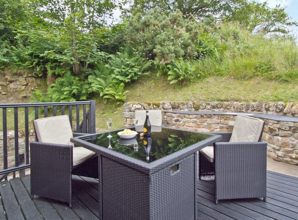 Enjoy the peace and quiet on the decked patio at The Barn in Brampton, Cumbria