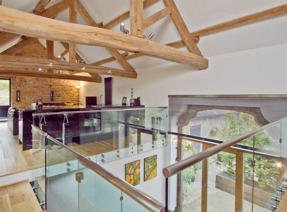 Modern designed open tread stairs in the open plan living area at The Barn in Brampton, Cumbria