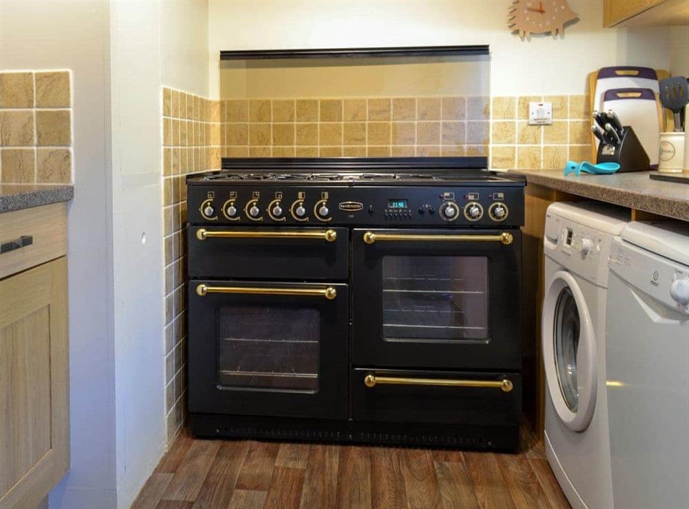 Galley style kitchen at The Barn in Buckton, near Flamborough, North Humberside