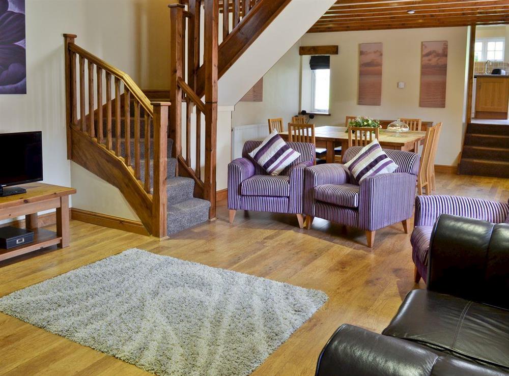 Living room with dining area at The Barn in Buckton, near Flamborough, North Humberside