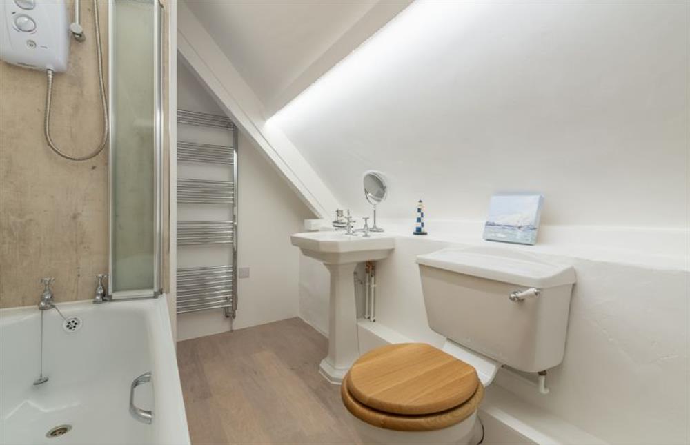 Second floor: Bathroom has bath with shower over at The Barn, Burnham Overy Staithe near Kings Lynn