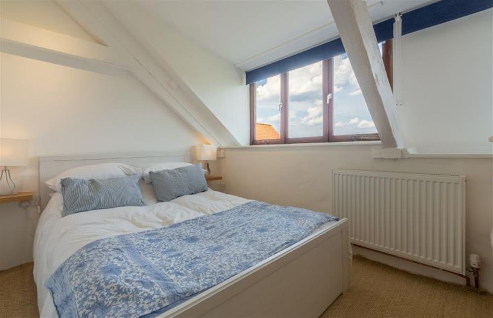 Second floor: Bedroom two, double bed and great views at The Barn, Burnham Overy Staithe near Kings Lynn