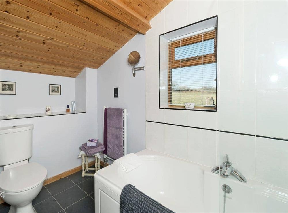 Bathroom with shower over bath (photo 2) at The Barn by The Lake in Brompton Regis, near Dulverton, Somerset