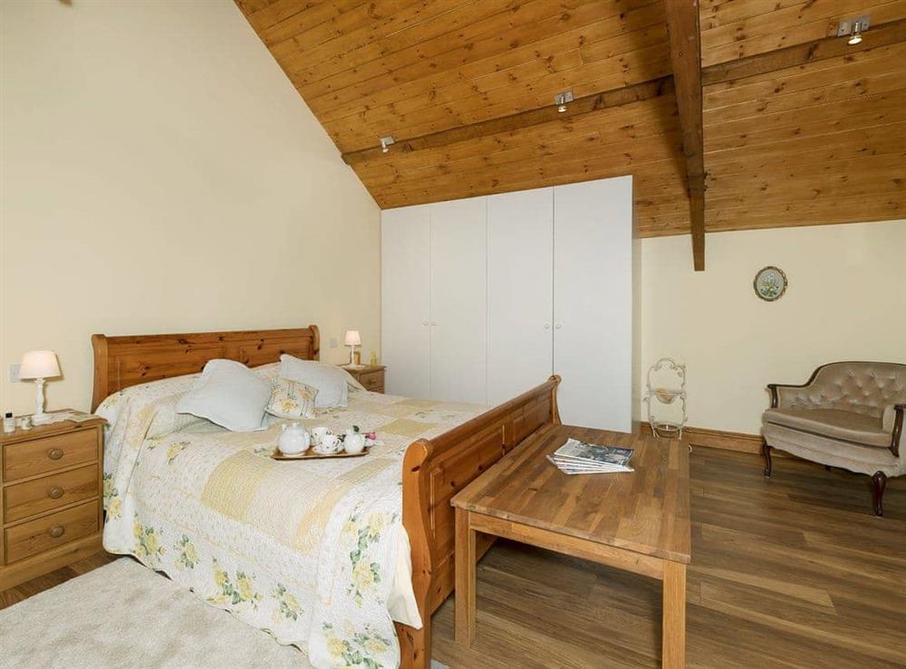 Spacious double bedroom with kingsize bed (photo 2) at The Barn by The Lake in Brompton Regis, near Dulverton, Somerset