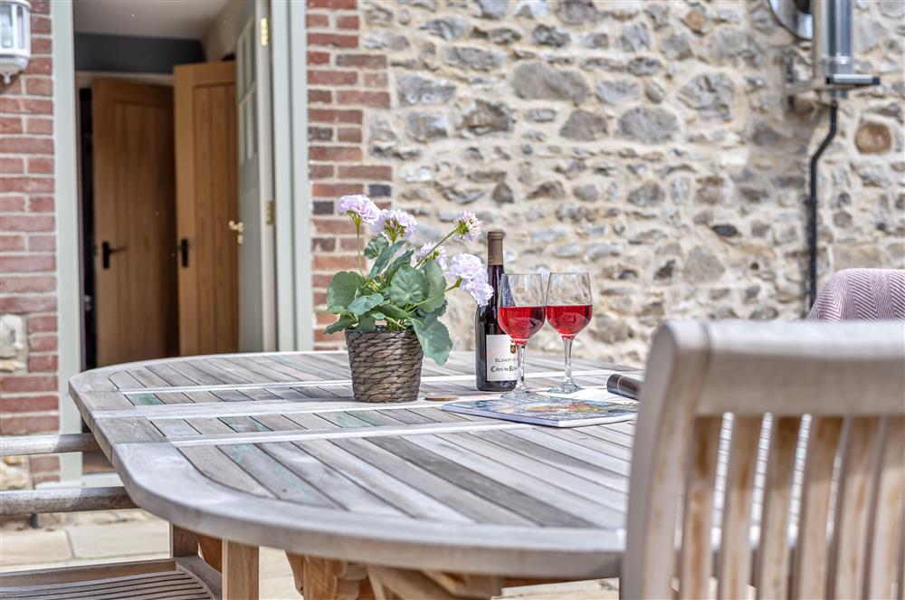 The courtyard garden with garden furniture at The Barn, Chard, West Dorset