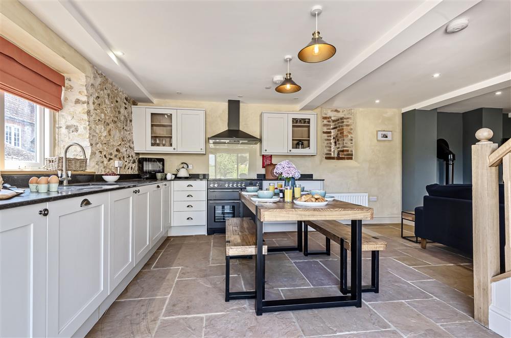 The dining kitchen with range cooker has plenty of space for entertaining at The Barn, Chard, West Dorset