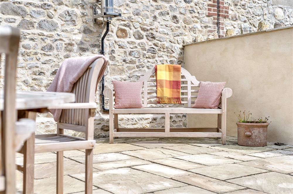 The garden bench offers a nice spot to relax at The Barn, Chard, West Dorset