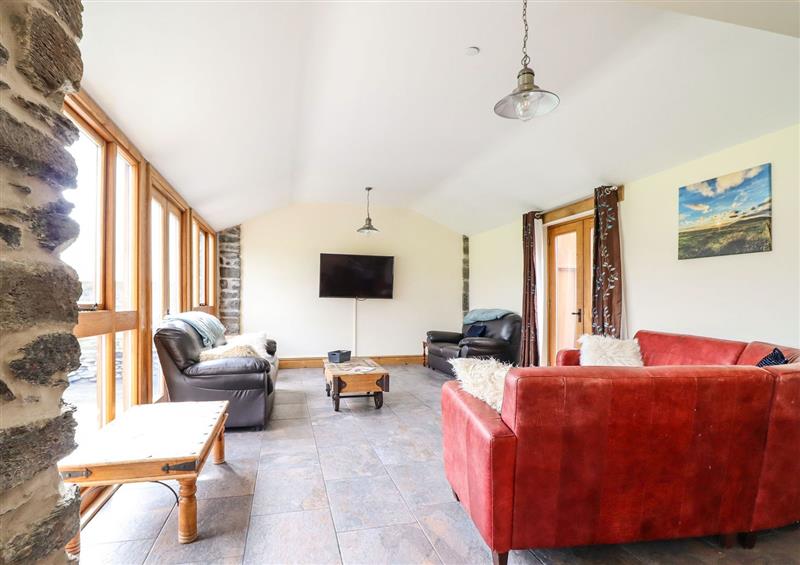 Relax in the living area at The Barn, Corwen