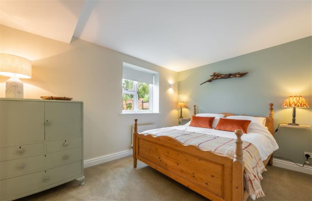 Ground floor: Master bedroom with king-size bed at The Barn, Great Ryburgh near Fakenham
