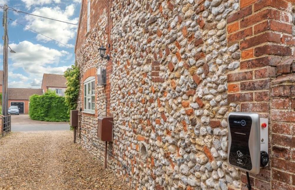 Parking area with universal charging point for electric cars at The Barn, Great Ryburgh near Fakenham