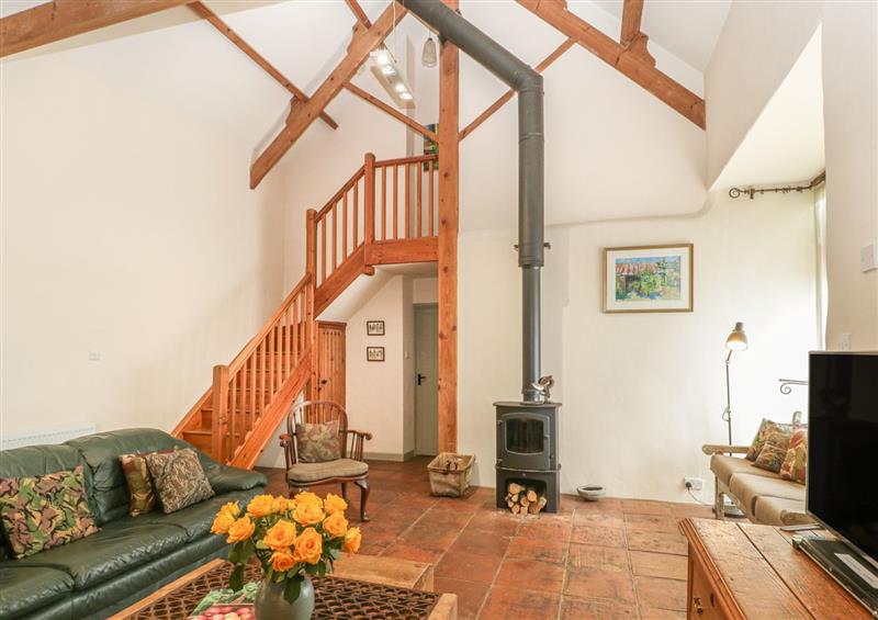 Living room with wood burning stove at The Barn, Honiton, Devon