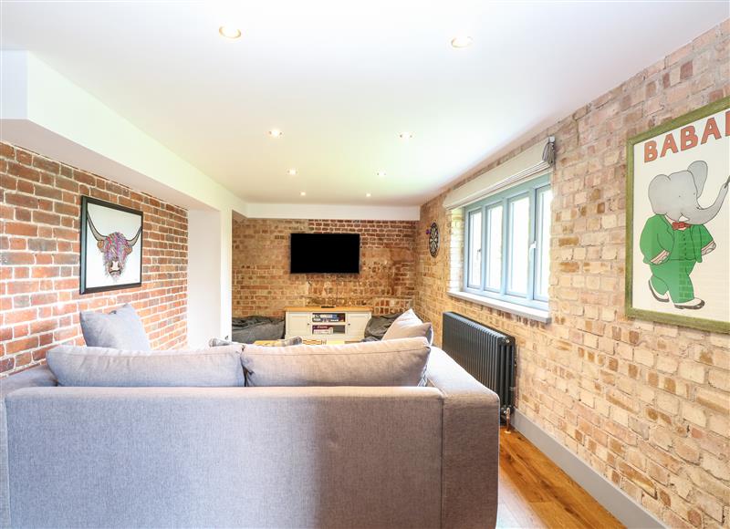 Relax in the living area at The Barn, Hoveton & Wroxham