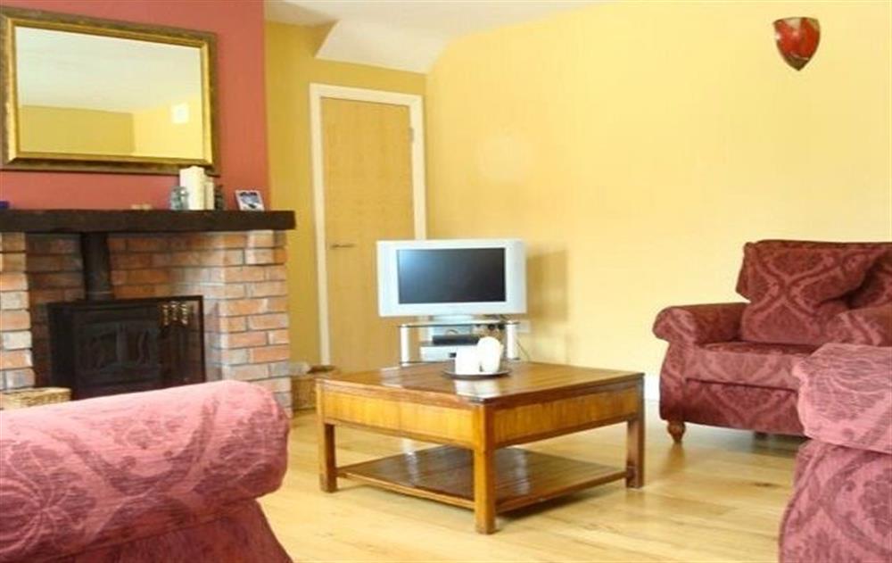 Ground floor:  Spacious sitting room with oak floors and multi-fuel stove at The Barn (Ireland), Navan