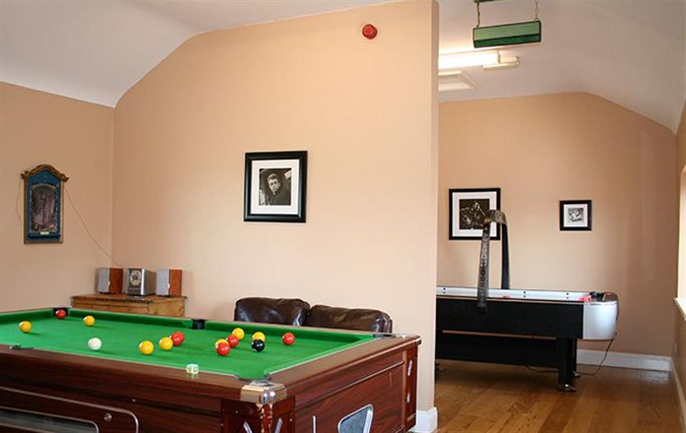 Indoor den with pool table, air hockey, books and DVD's