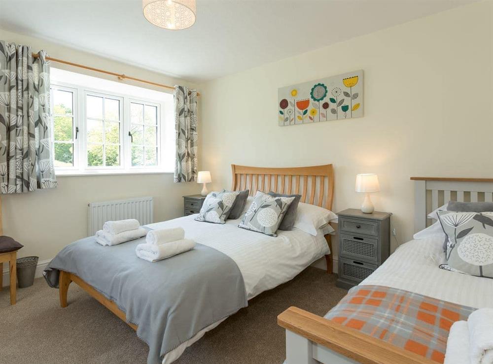 Family bedroom with a double and a single bed at The Barn, Oak Tree Farm in West Witton, near Leyburn, Yorkshire, North Yorkshire