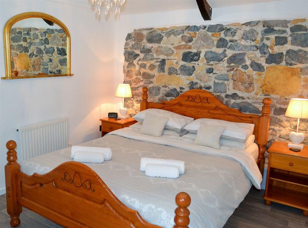 Tranquil bedroom with kingsize bed at The Barn in St Austell, Cornwall