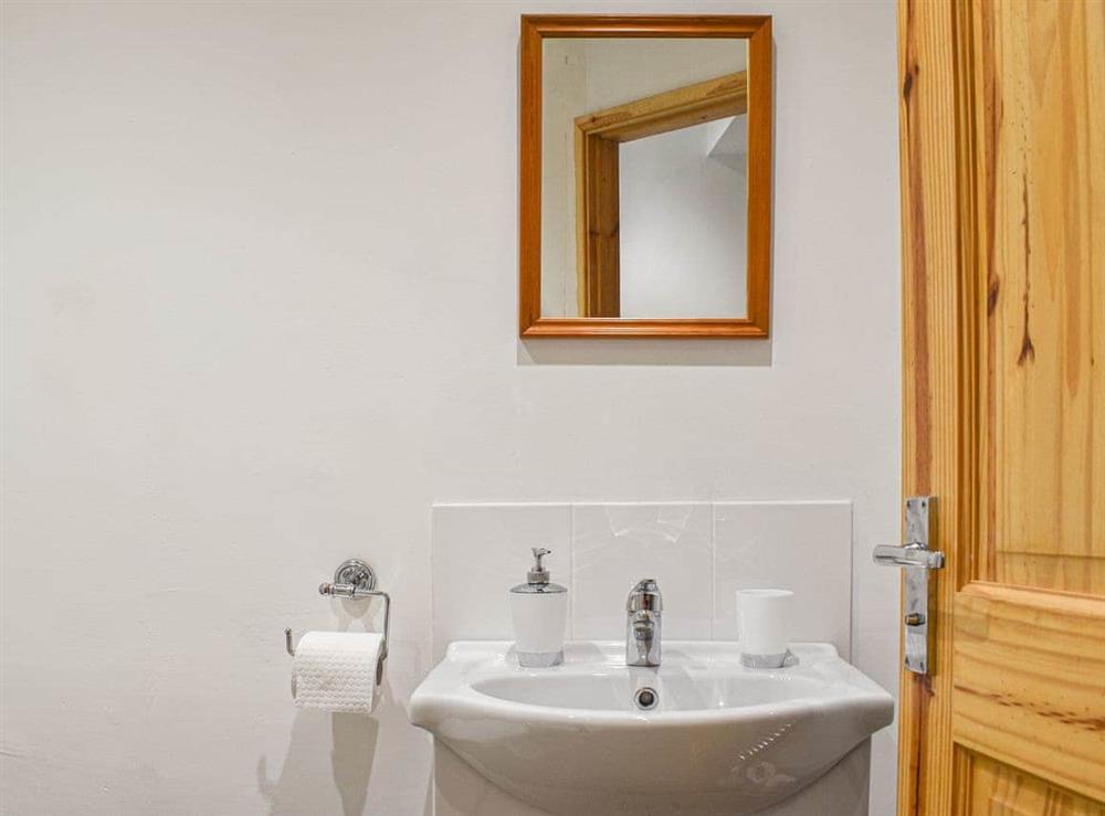 Bathroom with shower cubicle toilet and basin at The Barnsdale in Amlwch, Anglesey, Gwynedd