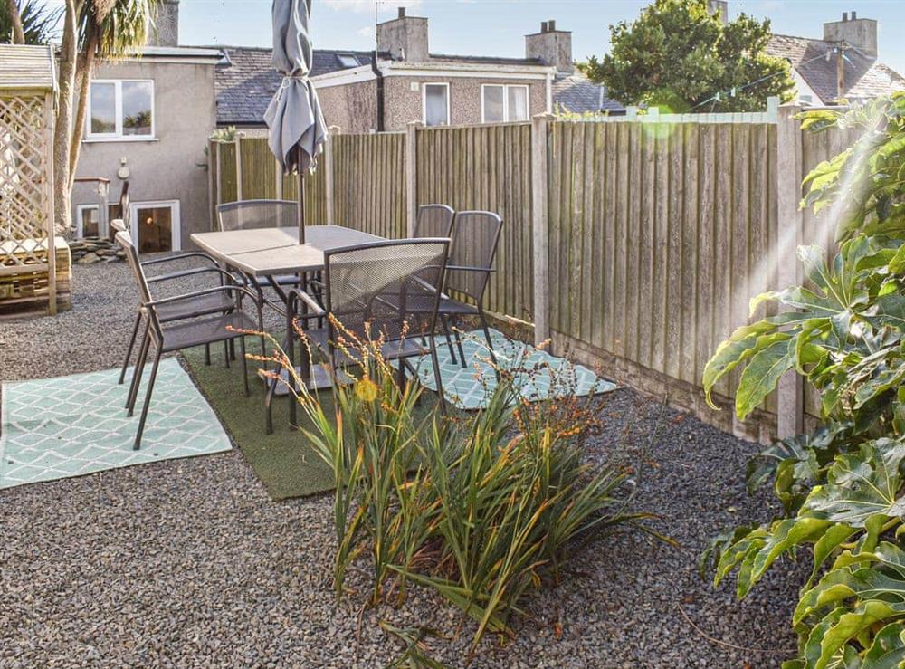 Enclosed back garden with sitting out area at The Barnsdale in Amlwch, Anglesey, Gwynedd