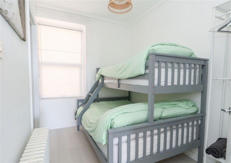 One of the bedrooms at The Beach Condo, Weymouth