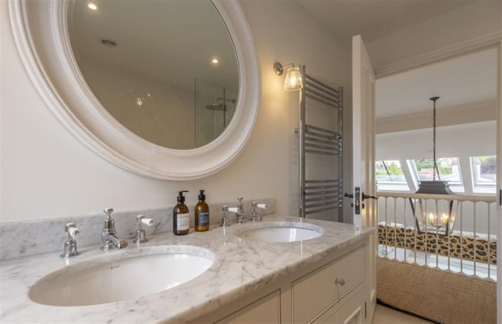 Bathroom with feature bath and shower over (photo 2) at The Beach House, Brancaster near Kings Lynn