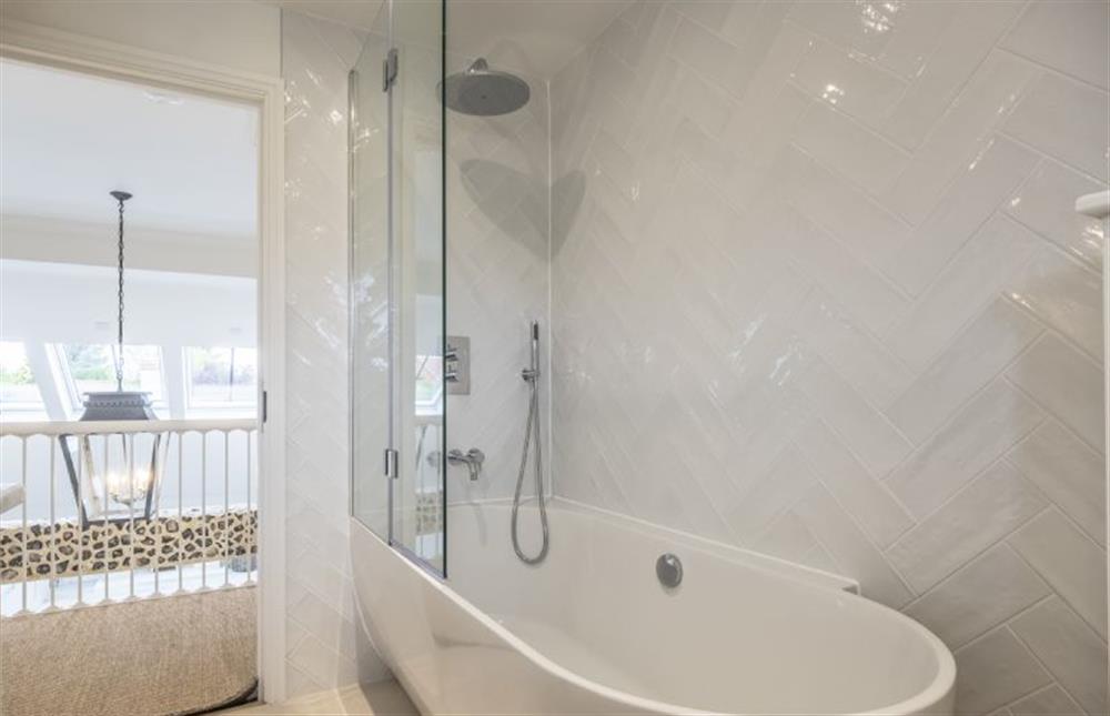Bathroom with feature bath and shower over (photo 3) at The Beach House, Brancaster near Kings Lynn