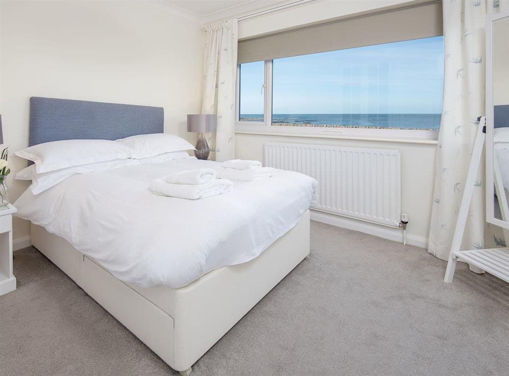 Comfortable double bedroom with sea views at The Beach House in Chathill, Northumberland