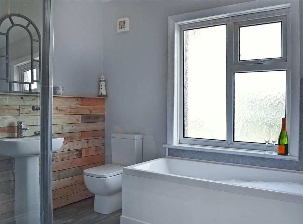 Bathroom with bath and shower cubicle at The Beach House in St Annes-on-the-Sea, Lancashire