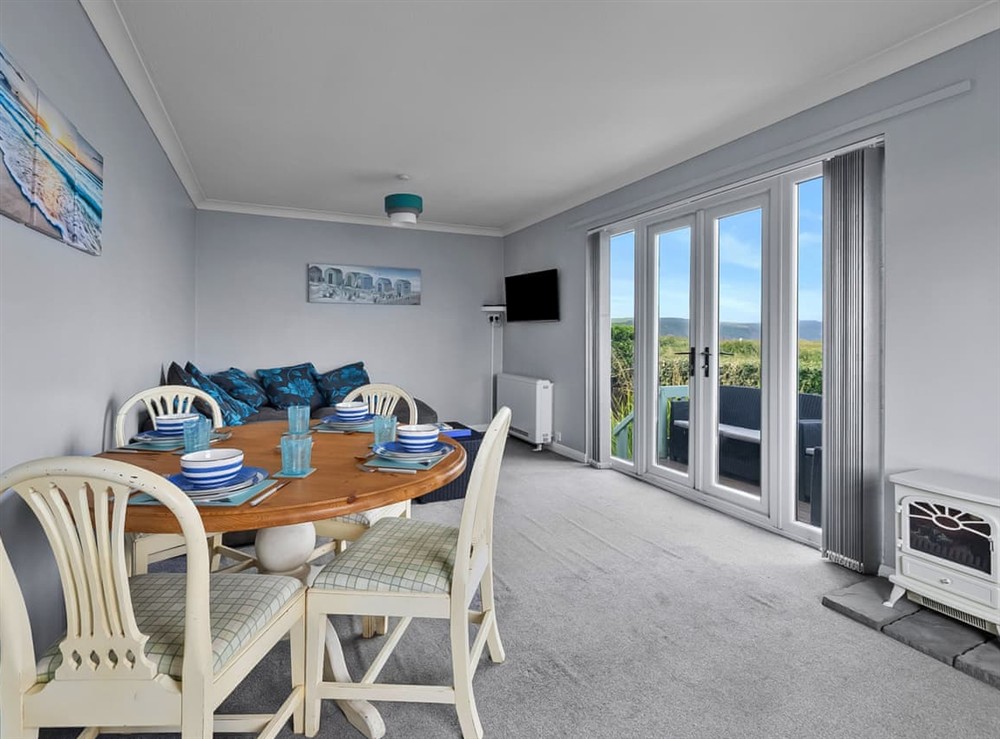 Living room/dining room at The Beach Hut in Bude, Cornwall