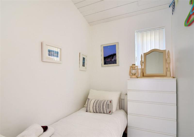 A bedroom in The Beach Hut at The Beach Hut, Lyme Regis