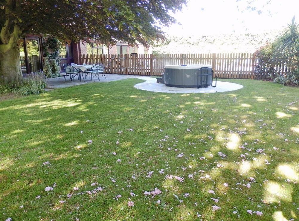 Hot tub and garden at The Beech House in Corton, near Lowestoft, Suffolk