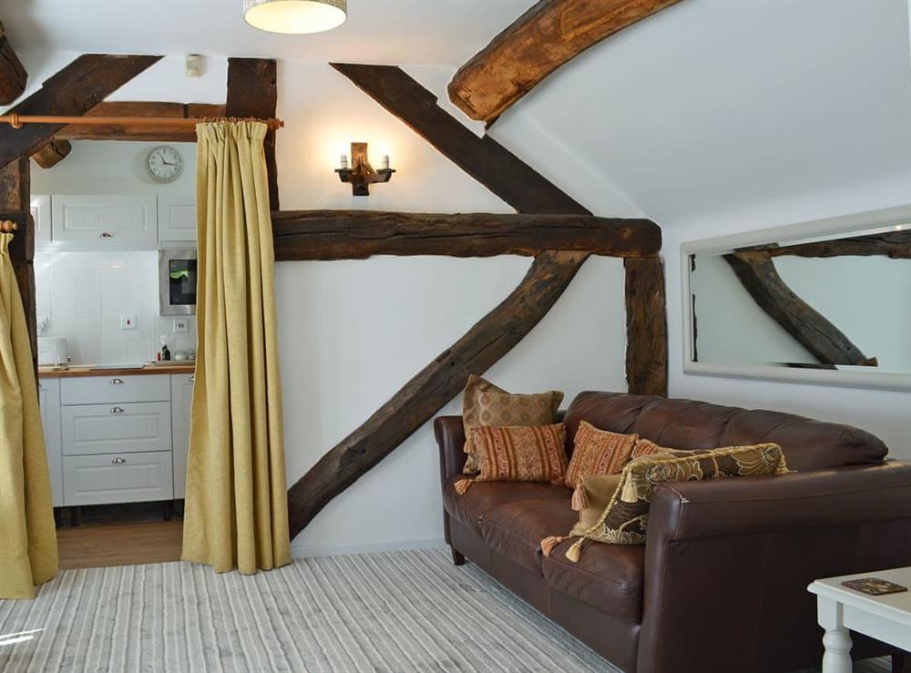 Cosy living/dining room with beams at The Beehive in Betley, near Crewe, Staffordshire