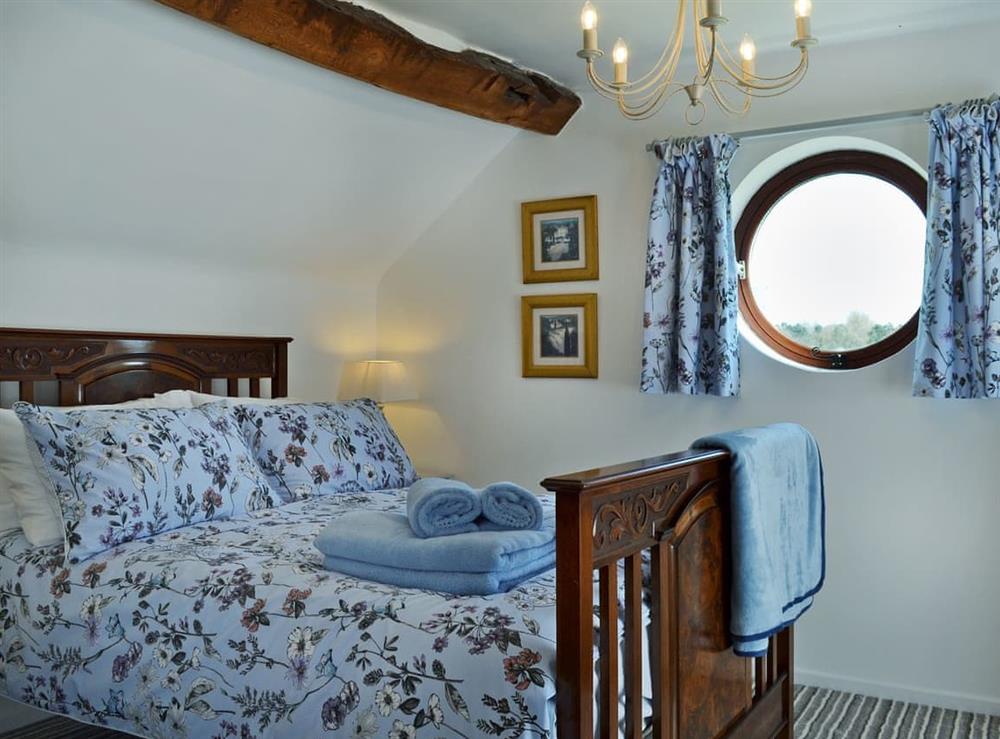 Elegantly decorated double bedroom with beams at The Beehive in Betley, near Crewe, Staffordshire