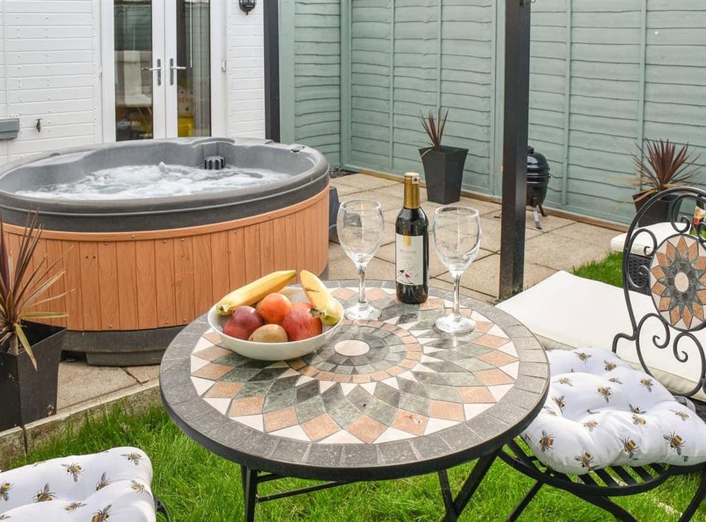 Furnished outdoor area with hot tub at The Beehive in Mundesley, Norfolk