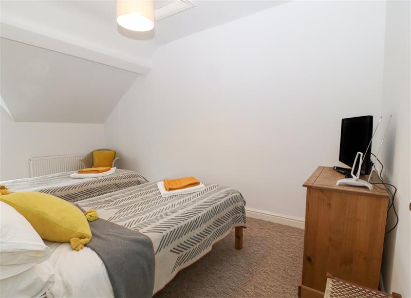 This is a bedroom at The Bell Apartment, Cemaes Bay