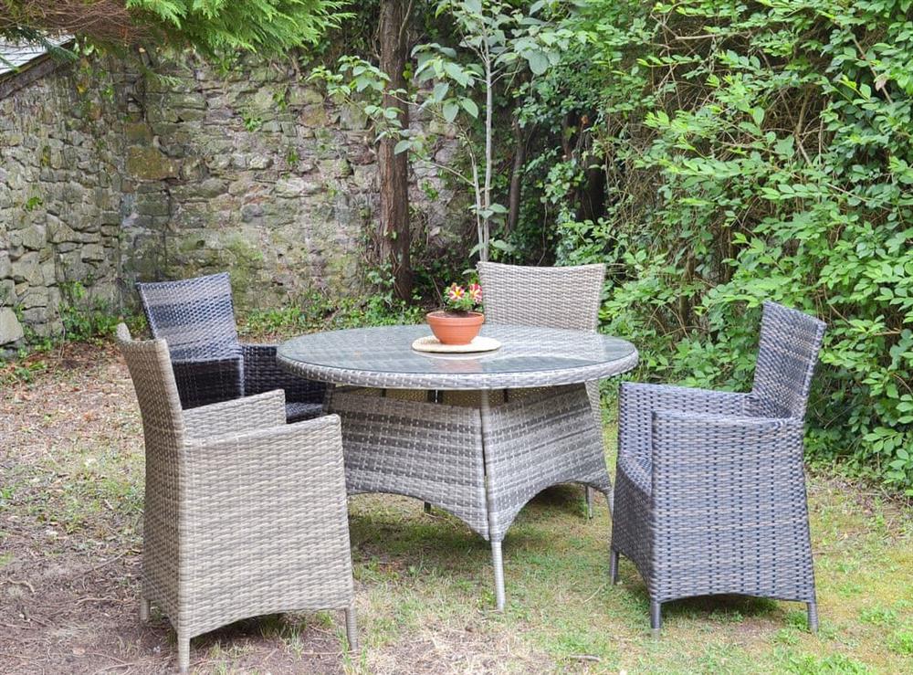 Lovely walled garden with table and chairs at The Berry in Marldon, near Paignton, Devon