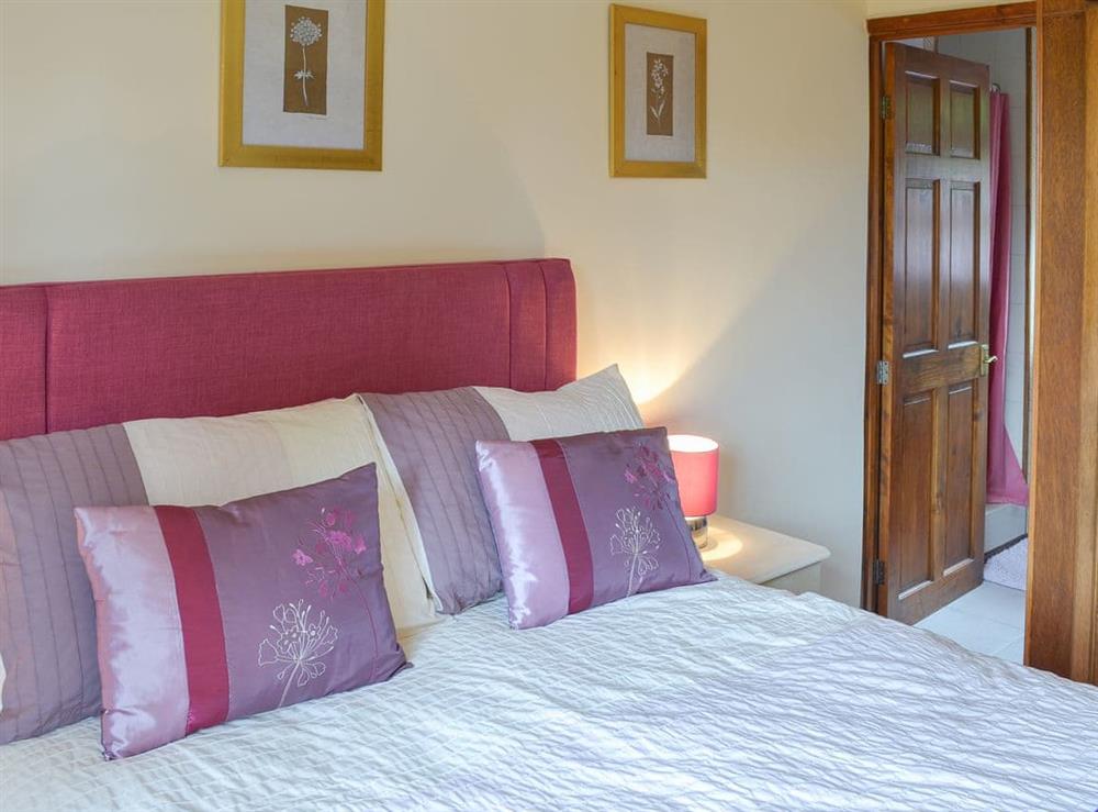 Relaxing double bedroom with en-suite shower room at The Berry in Marldon, near Paignton, Devon