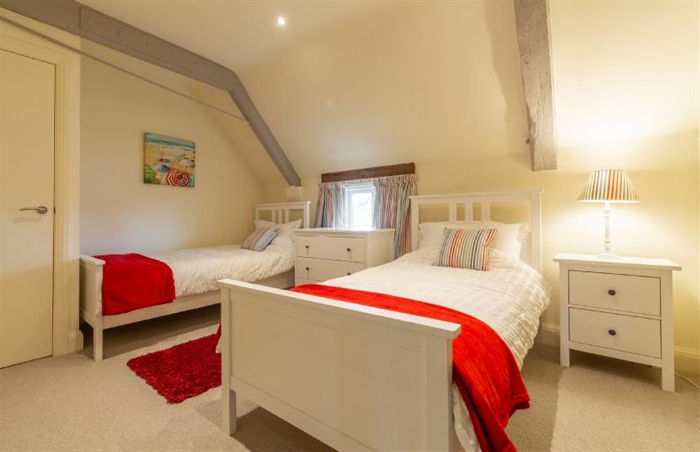 First floor: Bedroom four with twin beds at The Big Barn, Snettisham near Kings Lynn