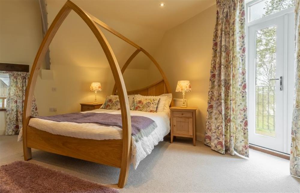 First floor: Doors in the master bedroom open to a balcony  at The Big Barn, Snettisham near Kings Lynn