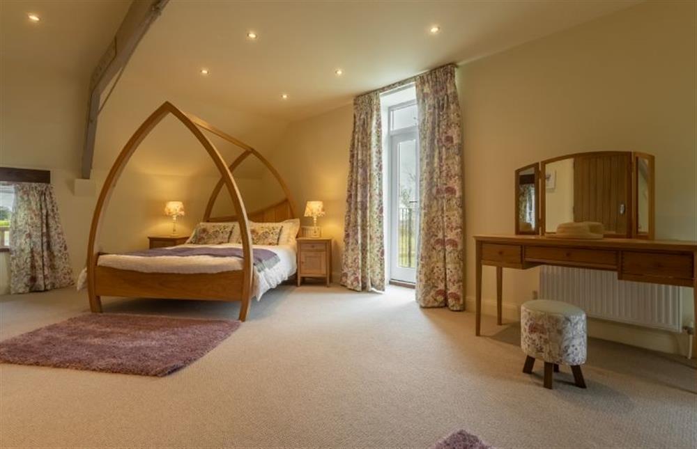 First floor: Master bedroom with 5ft king-size bed at The Big Barn, Snettisham near Kings Lynn