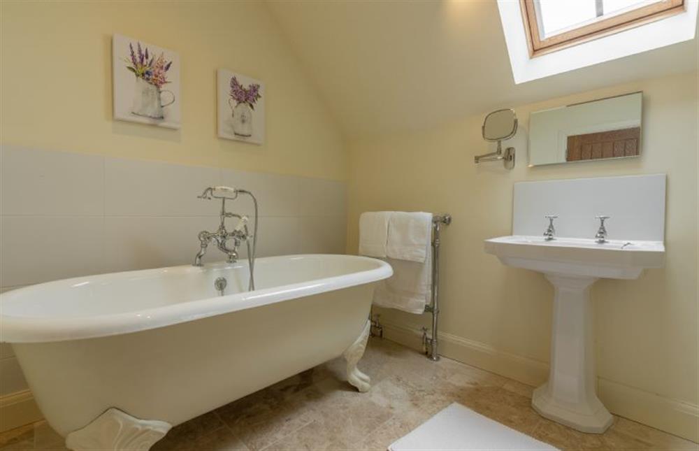 First floor: Master en-suite with roll top bath and shower cubicle at The Big Barn, Snettisham near Kings Lynn