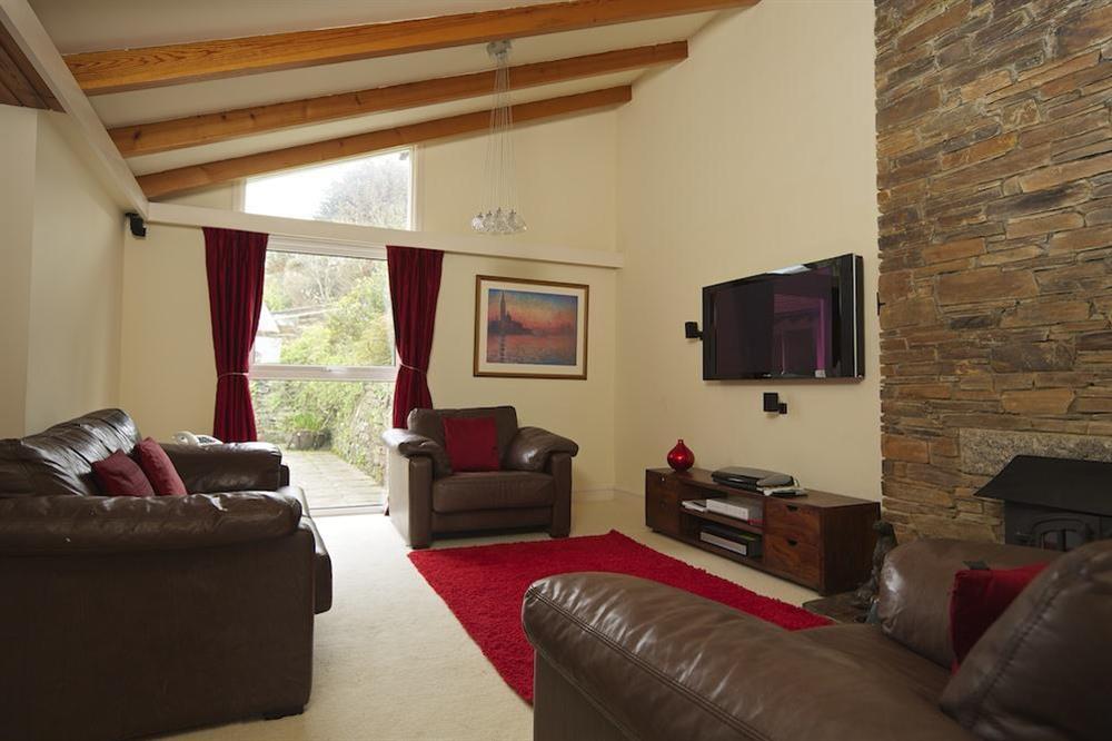 Cosy lounge with TV, DVD and wood-burning stove at The Bolt Hole in Hope Cove, Nr Kingsbridge