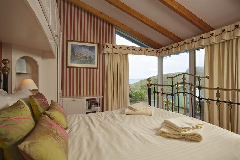 En suite master bedroom with King-size bed and sea views at The Bolt Hole in Hope Cove, Nr Kingsbridge