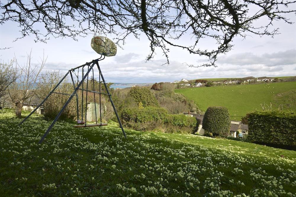 Lawn with children's play area at The Bolt Hole in Hope Cove, Nr Kingsbridge