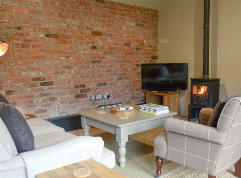 Delightful living area, with a cosy wood burner at The Bolthole in Tibthorpe, near Driffield, North Humberside