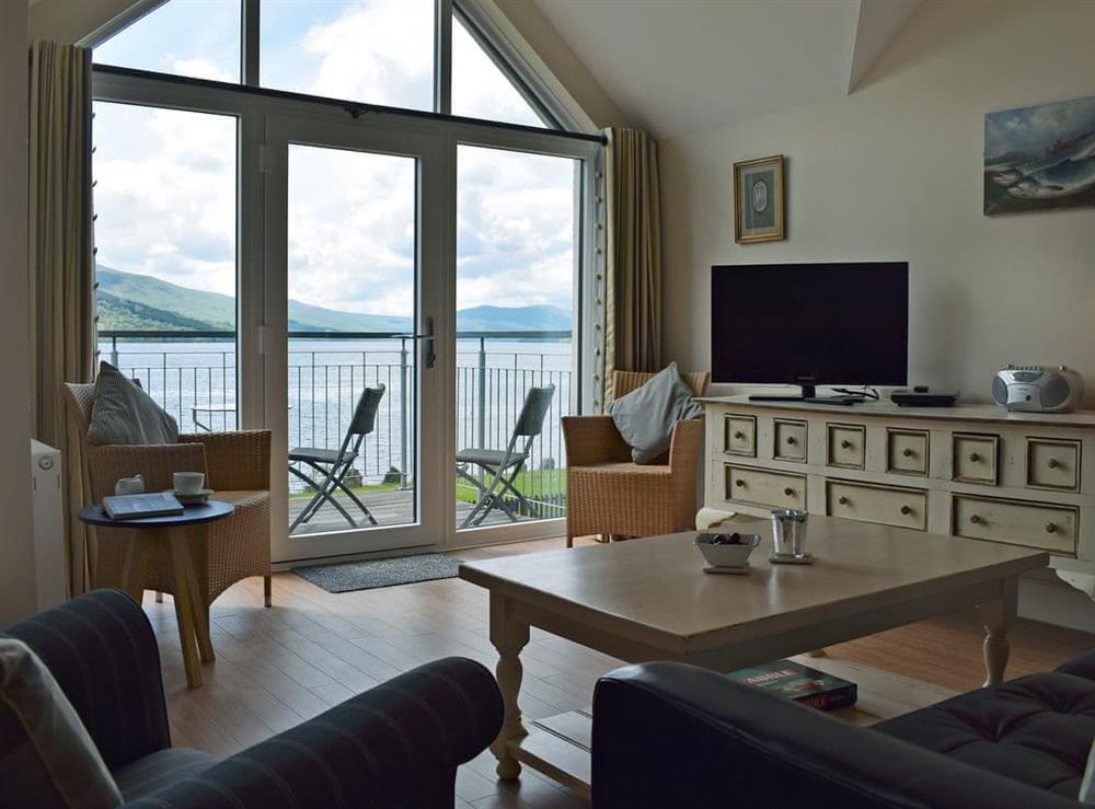 Cosy living area with breathtaking views at The Bothy in Fearnan, near Aberfeldy, Perthshire