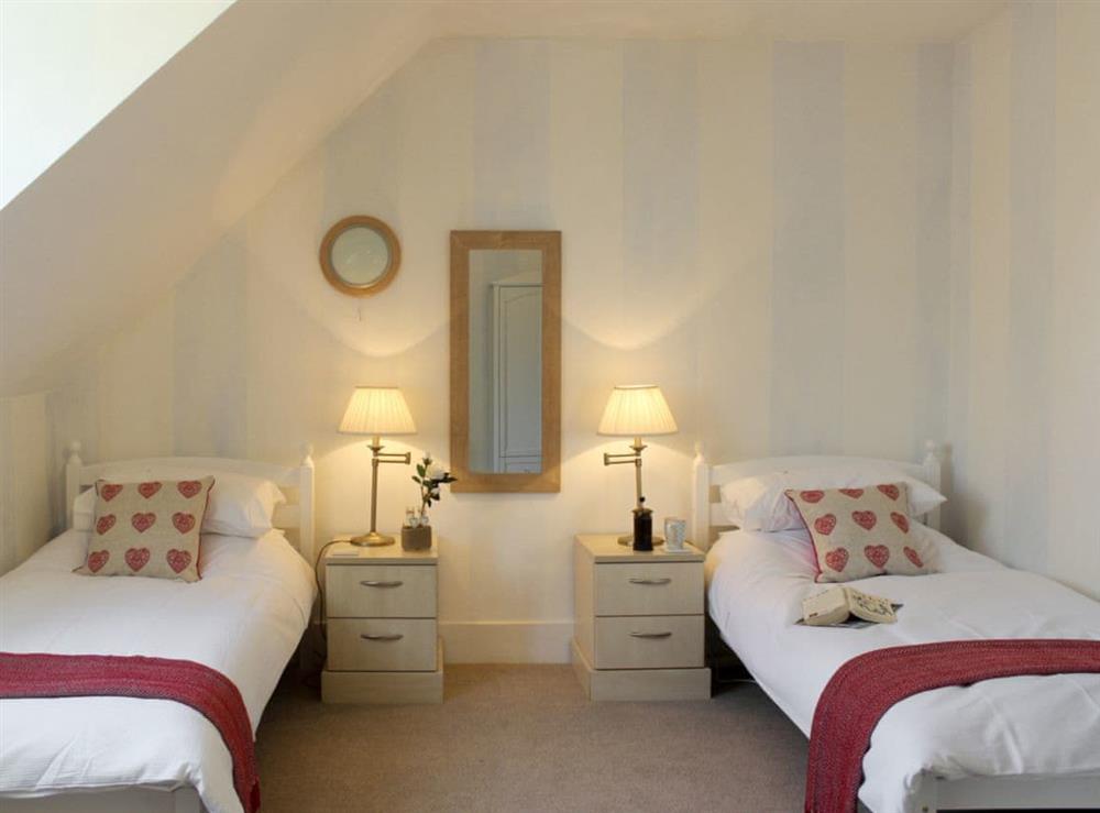 Relaxing twin bedroom at The Bothy in Lymington, Hampshire