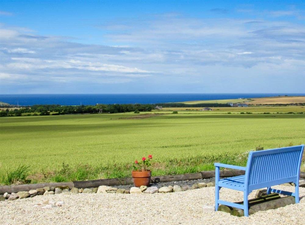Sitting out area with sweeping panoramic sea views at The Brae Steading in Fordyce, Aberdeenshire